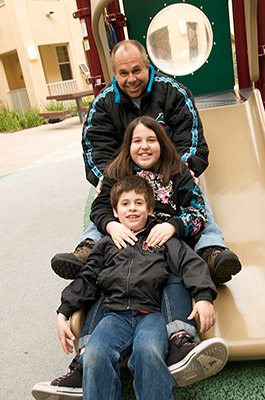 Family on a playground in Chula Vista, CA