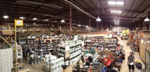Wide panorama of our reuse warehouse full of salvaged new and gently-used building materials, furniture, appliances, and more