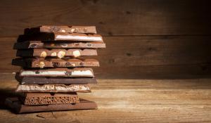 Image: stack of chocolate bars. Topic: Child Labor in Your Chocolate? Check Our Chocolate Scorecard