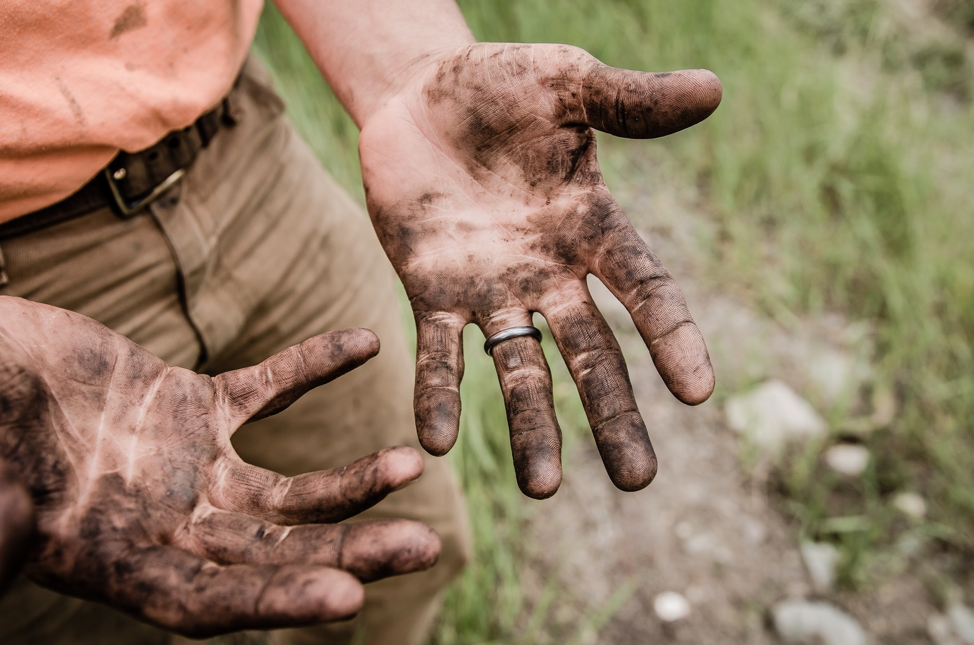 image of a farmer's dirt-covered hands