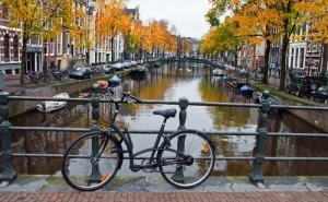bike on a bridge in front of a canal in Amerstdam