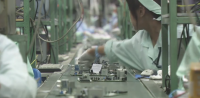 Image: workers on electronics assembly line. Title: End Smartphone Sweatshops
