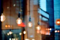 Image: light bulbs in a cafe. Topic: CFLs vs. LEDs: The Better Light Bulbs