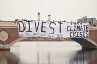 Boston-area university students gather for a joint banner drop over the Charles River to urge fossil fuel divestment.