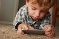 kid playing on a cell phone