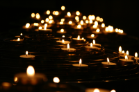 Lighted candles in the dark