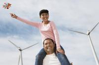 man and girl with windmills