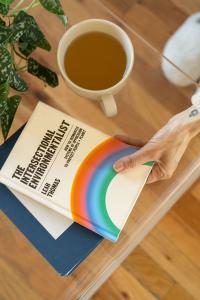 the intersectional environmentalist book sitting on a coffee table