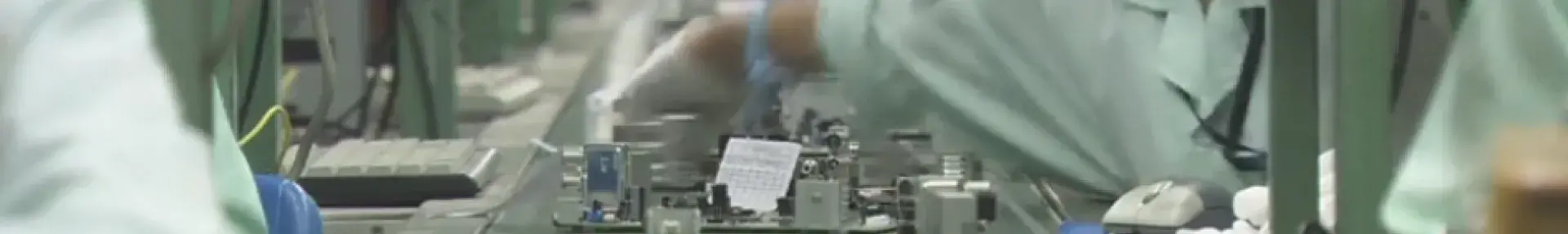 Image: workers on electronics assembly line. Title: End Smartphone Sweatshops