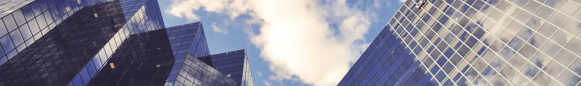 Image: upward view of skyscrapers. Topic: Break up with your mega-bank