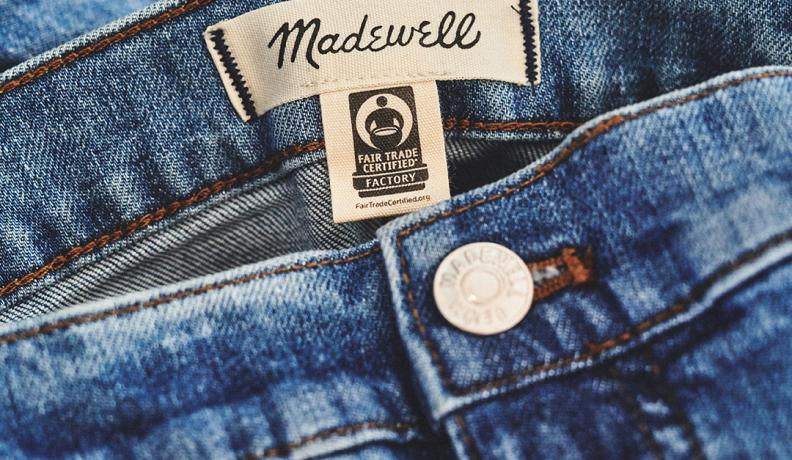 Image: close-up image of the fair trade tag on jeans. Topic: Are These Trends Green or Greenwashed?