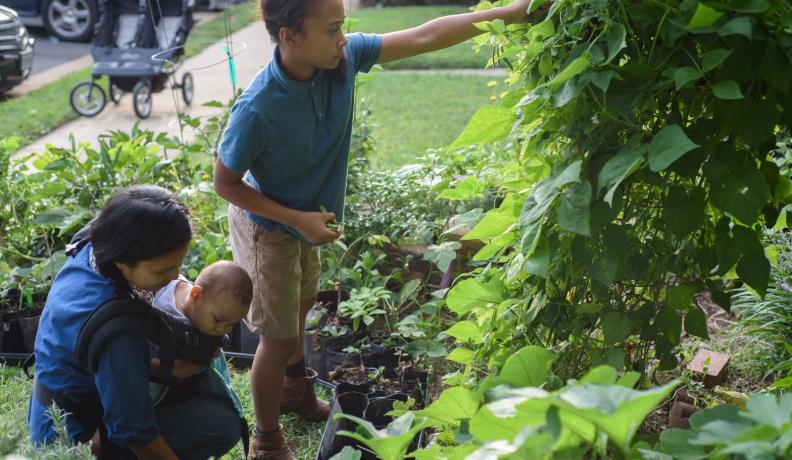 Nicky Schauder and her children working on the garden in their front yard in Herndon, Virginia. Photo by Danielle Lussier Photography. 