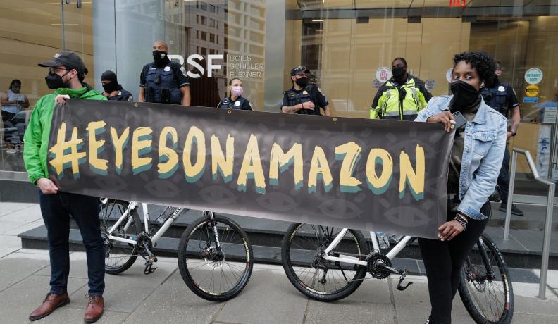 Protesters gather outside investors’ offices in Washington, DC, ahead of Amazon’s shareholder meeting in 2021. Photo by Phil Pasquini.