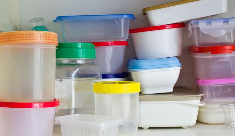 stacks of empty plastic tupperware containers