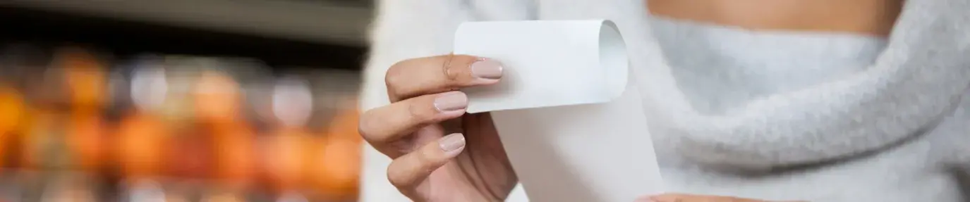 women holding a receipt