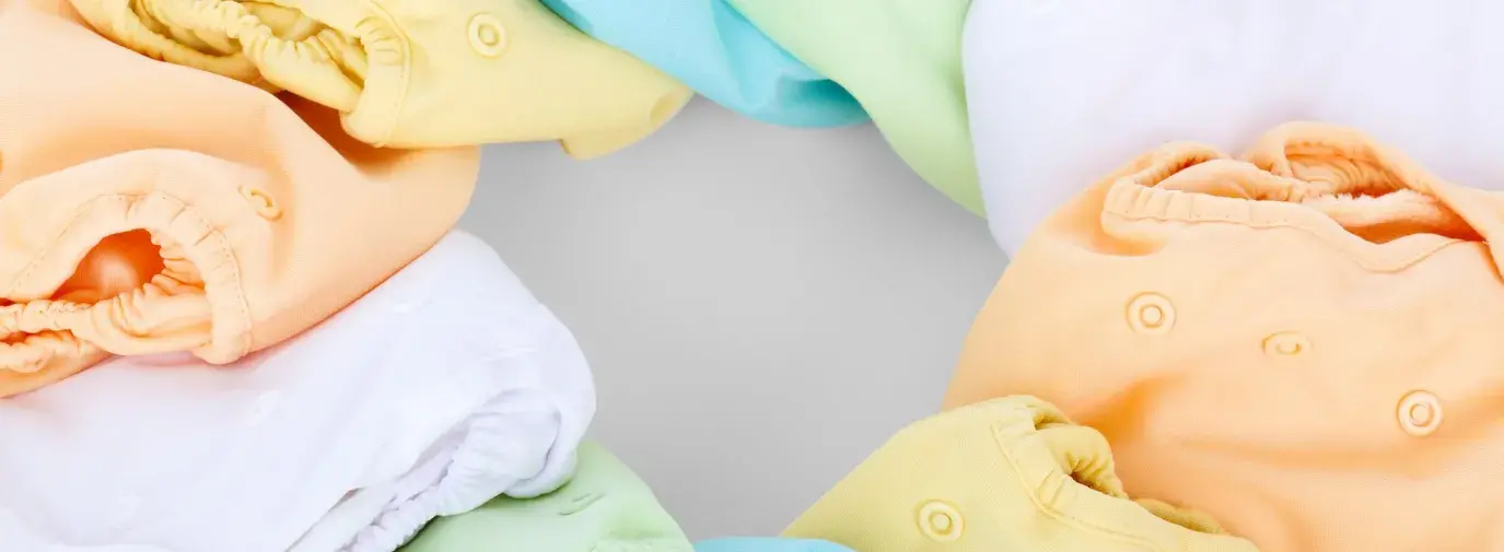 Image: colorful array of cloth diapers. Topic: Go Green With Cloth Diapers