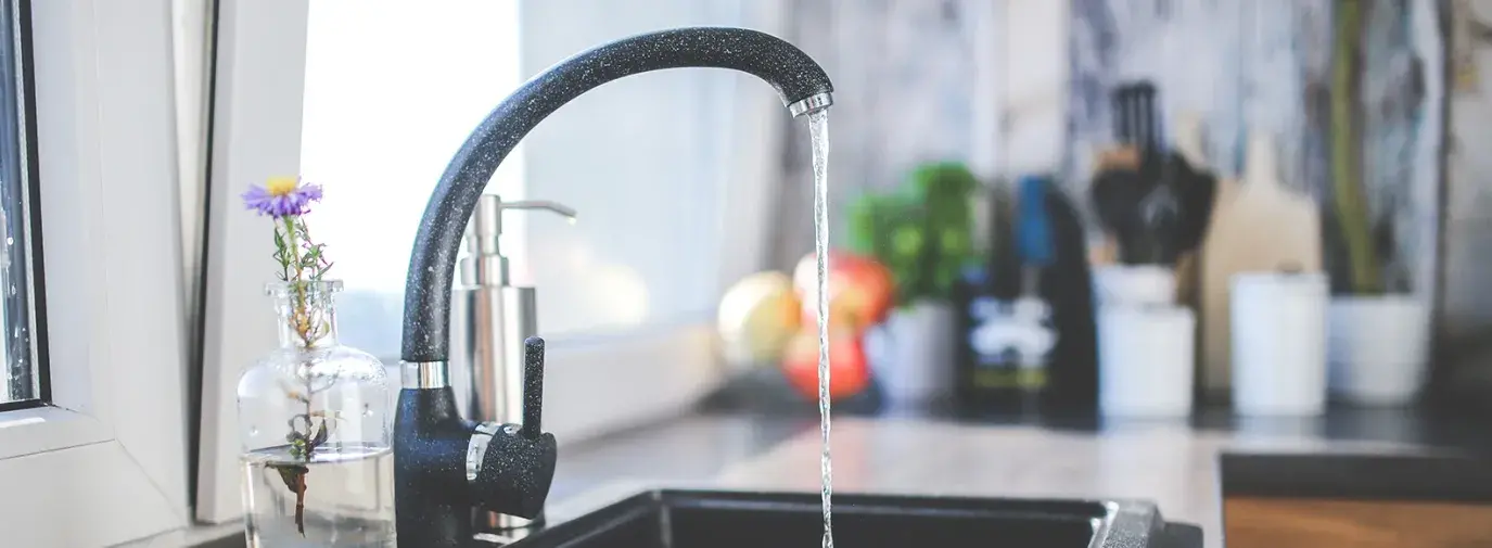 Image: running kitchen faucet. Topic: The Facts About Water Filters