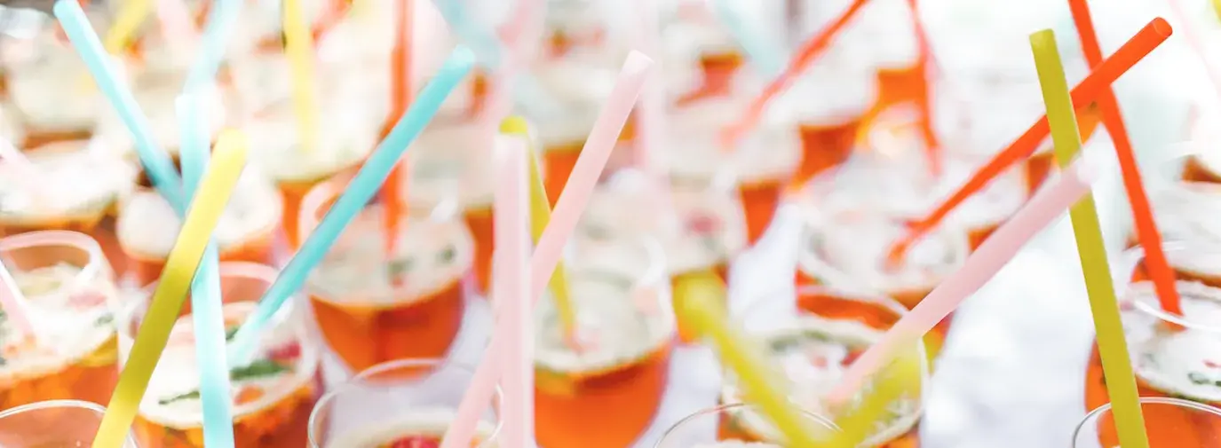 straws inside cocktail glasses; straw bans are flawed