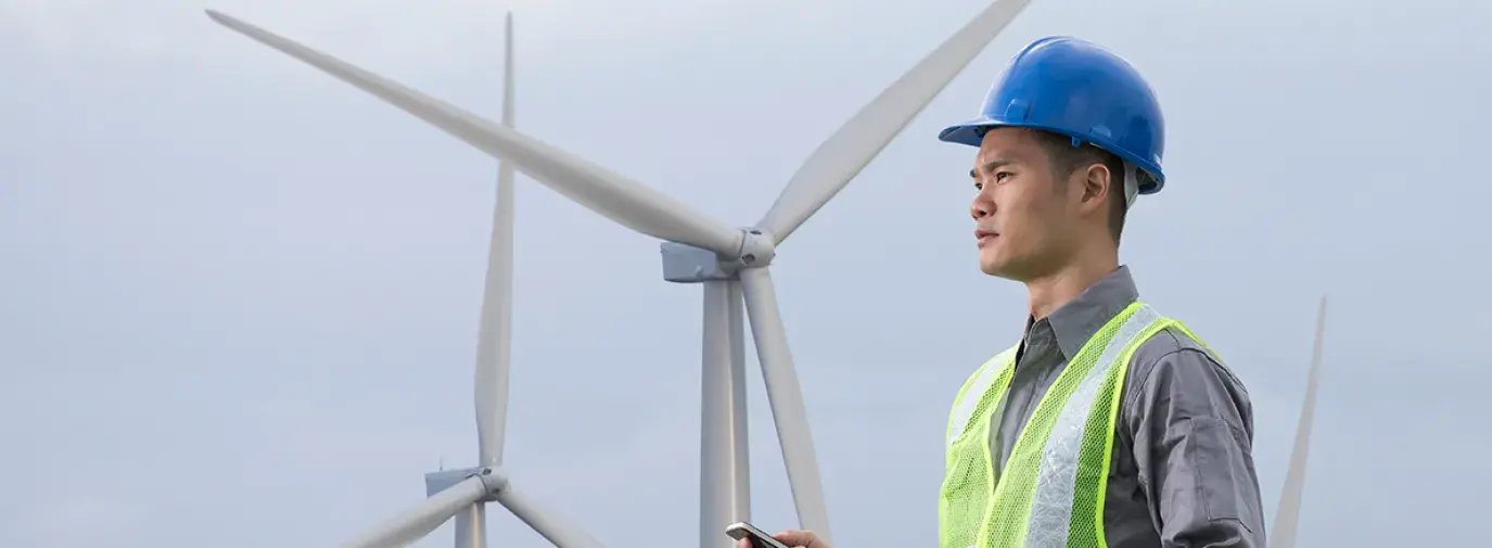 Image of a worker on a wind farm 