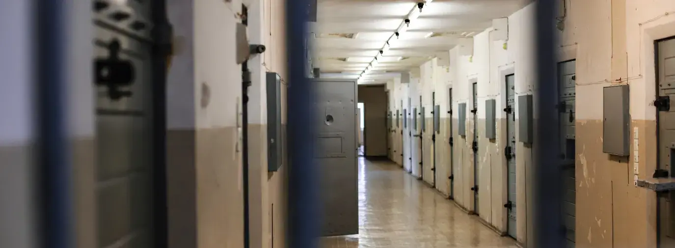 a prison hallway; financing of prisons is a problem of big banks