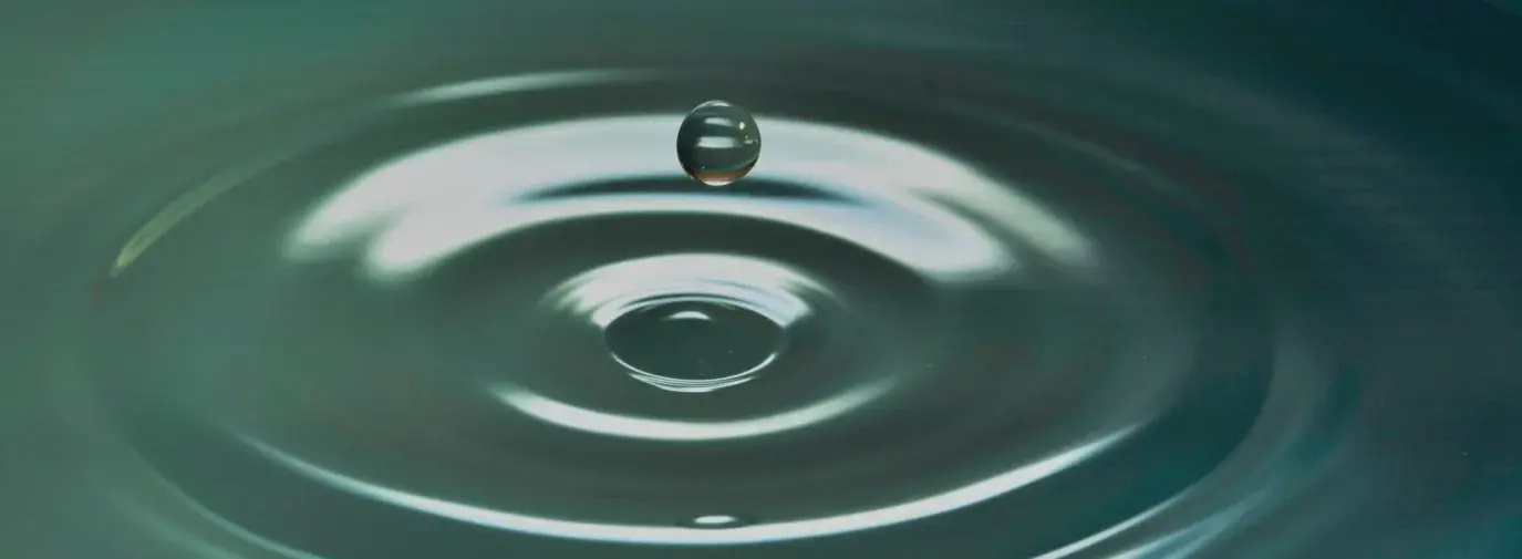 Drop of water creating ripple