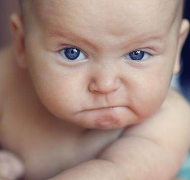 baby making disgusted face