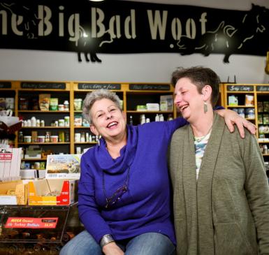 Julie Paez and Pennye Jones-Napier in their store, the Big Bad Woof, laughing