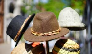 Image: rack of hats. Title: Time Banks and Bartering: Get What You Need Without Money