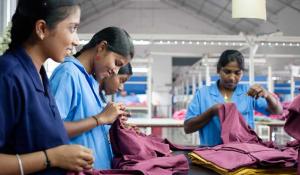 Image: women working with textiles. Title: In Search of Ethical Fashion