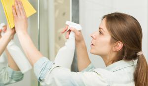 woman spraying cleaning product