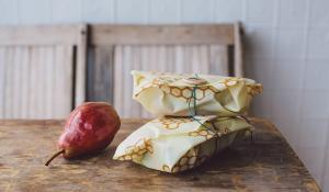 beeswrap sandwiches and a pear