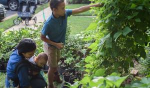 Nicky Schauder and her children working on the garden in their front yard in Herndon, Virginia. Photo by Danielle Lussier Photography. 
