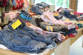Image: piles of secondhand clothing on sale